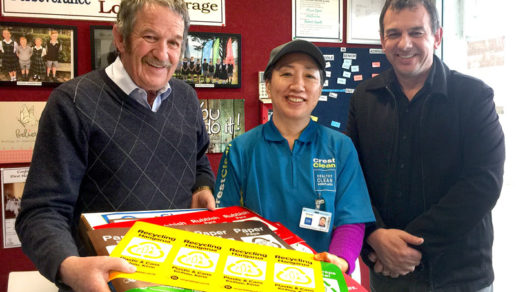 Regional Manager Glenn Cockroft and franchisee Kim Jin present a RecycleKiwi pack to Julian Ineson, Principal of Invercargill’s St Theresa’s School.