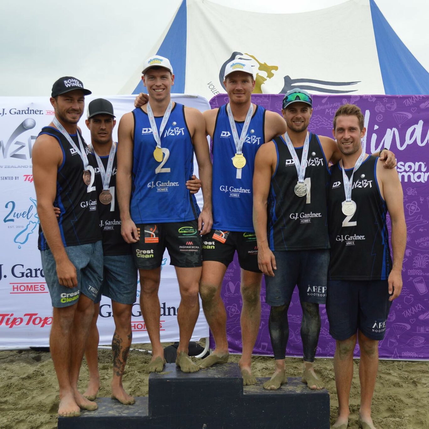 On the podium – J. Gardner Homes NZ Beach Volleyball Tour Nelson Gold Medal winners Sam Odea and Brad Fuller